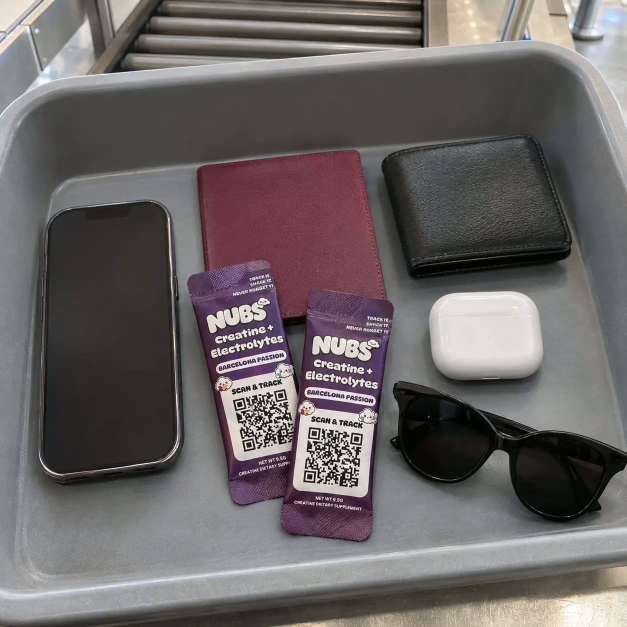 Nubs stick in an open carry-on suitcase with a passport and water bottle